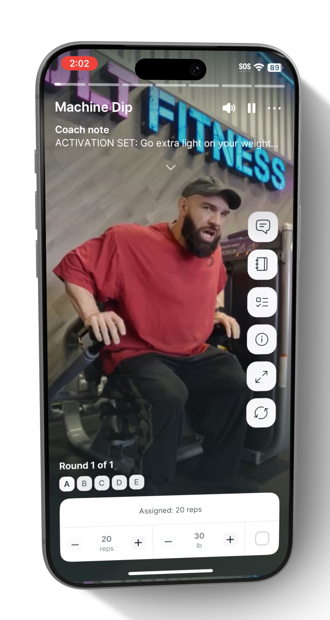 Phone displaying a fitness app with a person in a red shirt and cap on a white background