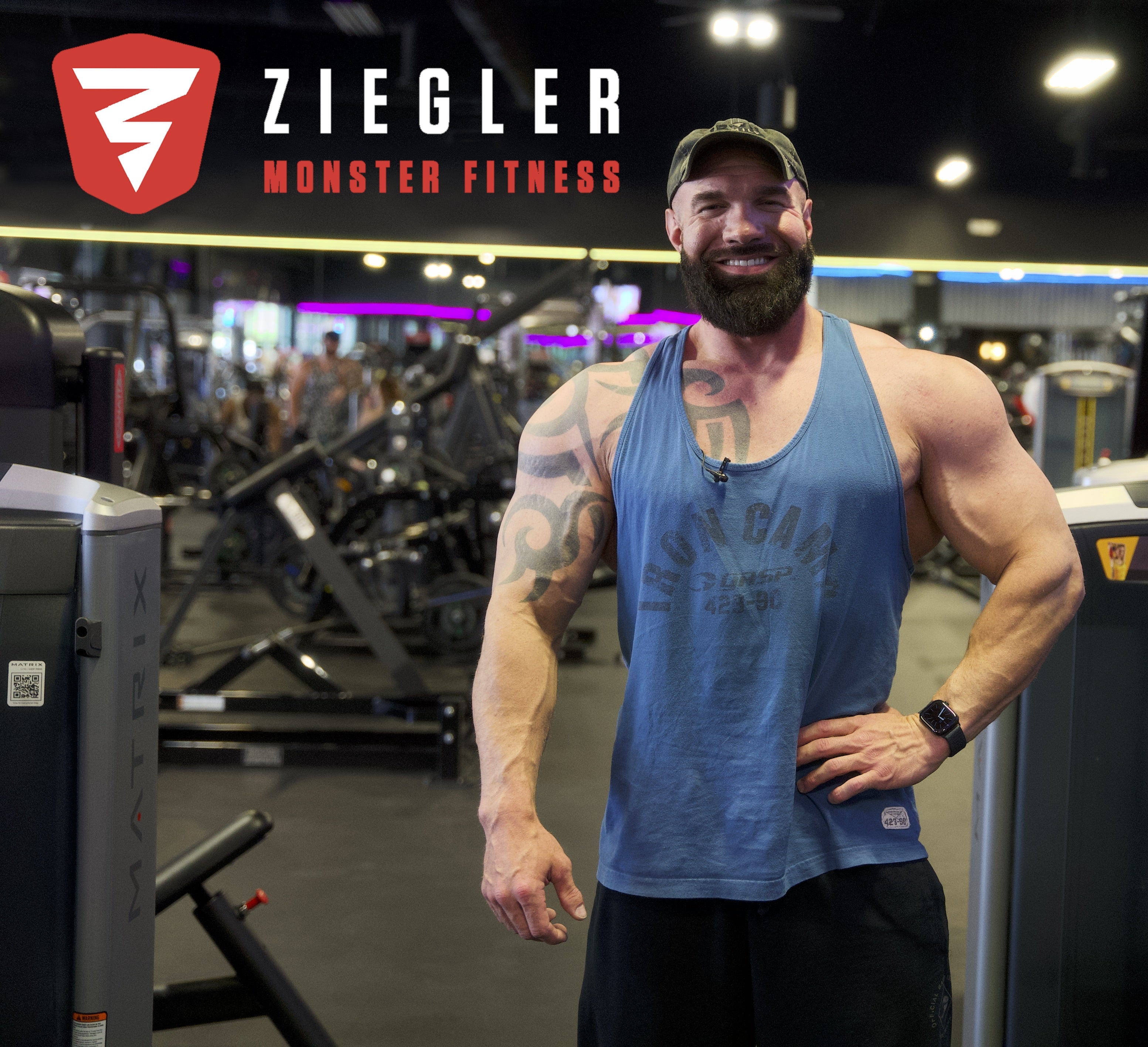 Man posing in a gym with Ziegler Monster Fitness branding